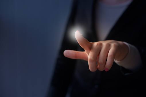 Woman touches the blank screen with her finger