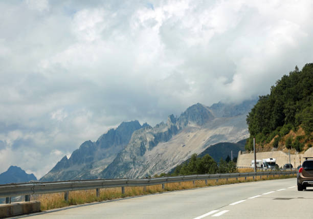 istock Panoramic Road between Italy and switzerland in Saint Gotthard Pass with car 1776701475