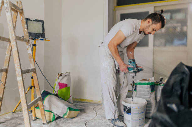 istock A plasterer is preparing building materials for skim coating walls. 1776702653