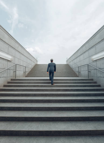 istock Human Resources to Success: Man in Suit Ascends Stairs into Bright Future 1776723611