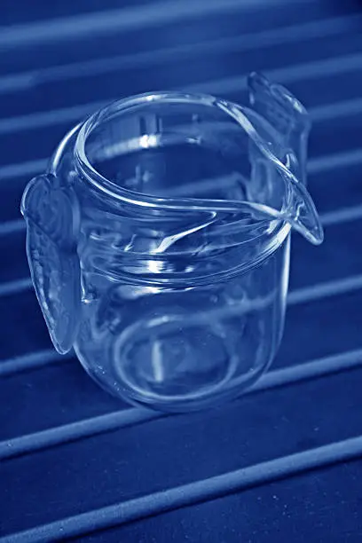 brown glass cup on a desk