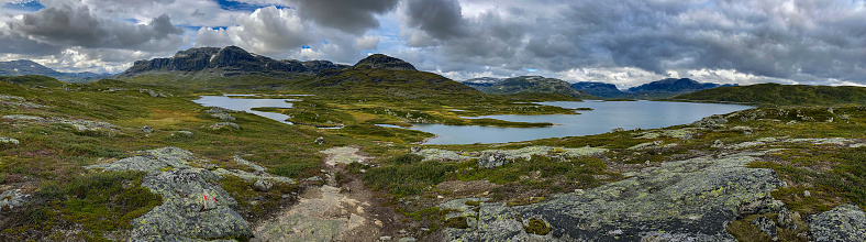 Panoramic view of Ståvatn lake and Sveigen Haukeli, Trollnup peaks from the summit of Kista, Norway