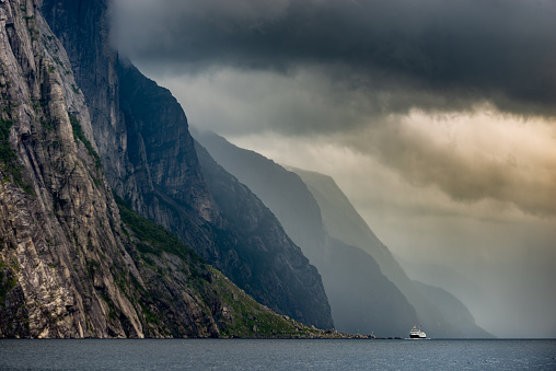 Lysefjord Beautiful Norway landscape, car ferry swims towards the town of lysebotn