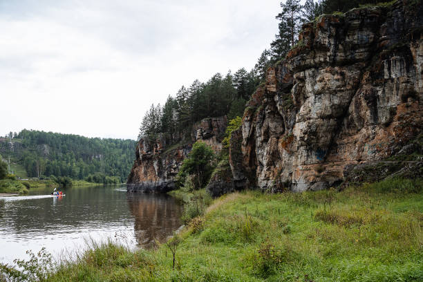 rock mass, river flows at the foot of the rocky mountains, white stone rocks, nature of Russia, southern Urals, Yuryuzan river, travel idea rock mass, river flows at the foot of the rocky mountains, white stone rocks, nature of Russia, southern Urals, Yuryuzan river, travel idea south ural stock pictures, royalty-free photos & images