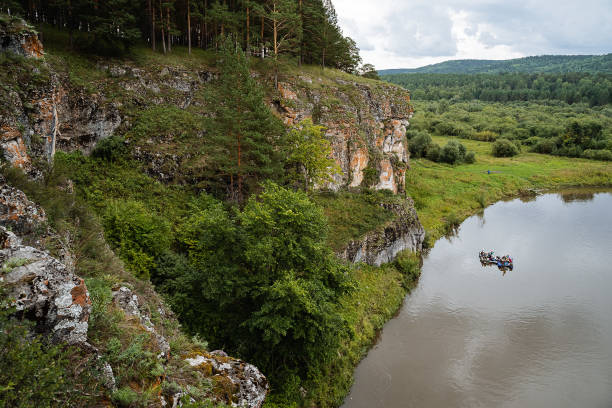 rock mass, river flows at the foot of the rocky mountains, white stone rocks, nature of Russia, southern Urals, Yuryuzan river, travel idea rock mass, river flows at the foot of the rocky mountains, white stone rocks, nature of Russia, southern Urals, Yuryuzan river, travel idea south ural stock pictures, royalty-free photos & images