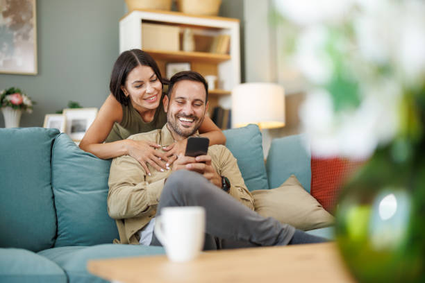 Young couple at home drinking coffee