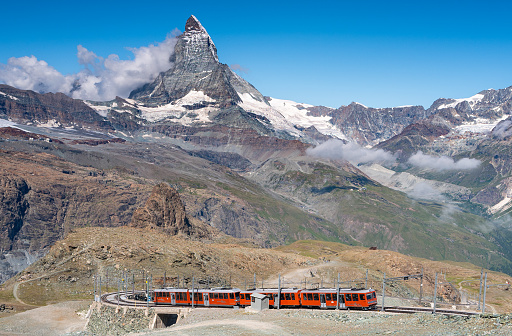 Zermatt, Switzerland - July 6, 2022: The Gonergrat train headed to the top of mountain and the Gronergrat railway station, a popular tourist destination to view the Matterhorn