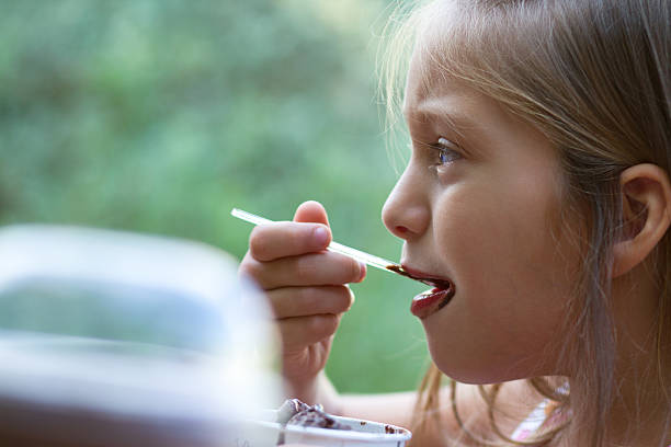 istock Little girl eating ice-cream 177683447