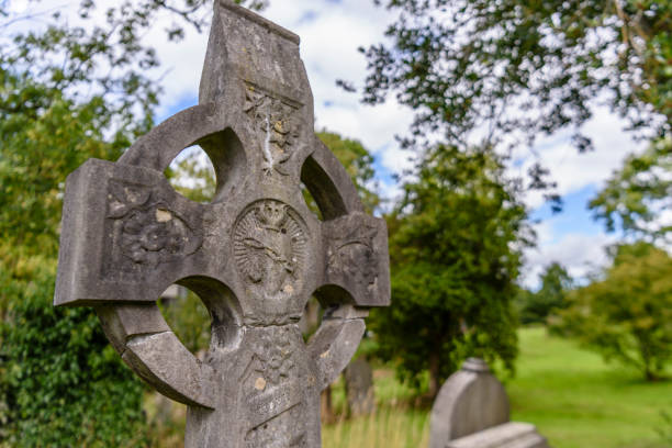 istock Celtic Cross with a sacred heart in an Irish graveyard. 1776835993