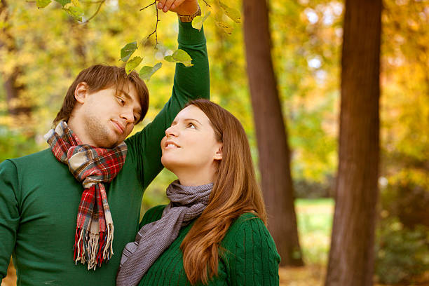 Young couple have fun in the park stock photo