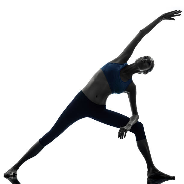 istock woman exercising stretching triangle pose yoga 177686345