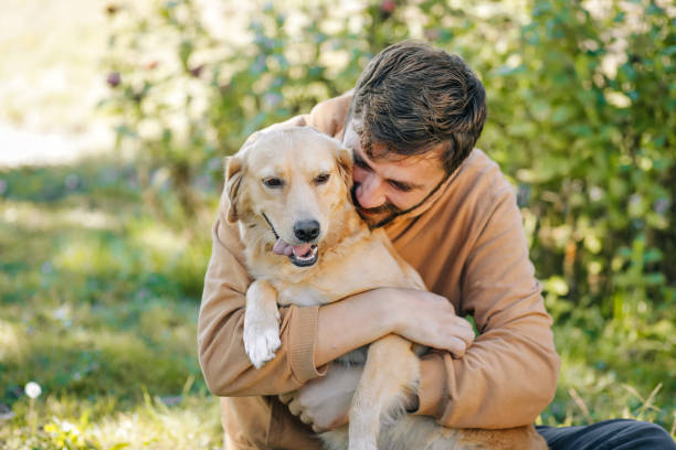 istock Guy and his dog, golden retriever, nature 1776867236