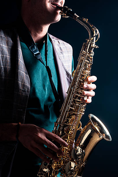 saxophone player - light jazz fotografías e imágenes de stock