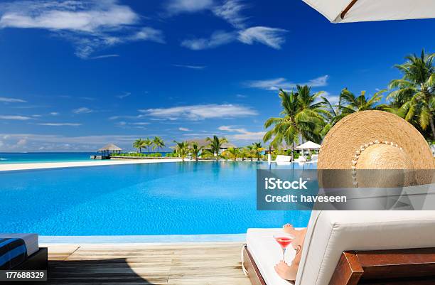 Woman At Poolside With Cosmopolitan Cocktail Stock Photo - Download Image Now - Maldives, Drink, Swimming Pool