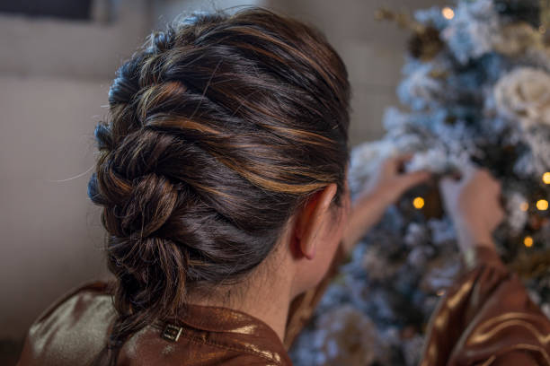 istock A woman prepares the Christmas tree 1776902678