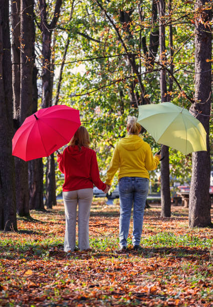 istock Mother and Daughter Enjoying Autumn Forest 1776910353