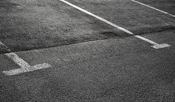 istock Empty parking places on dark asphalt with white lines 177692411