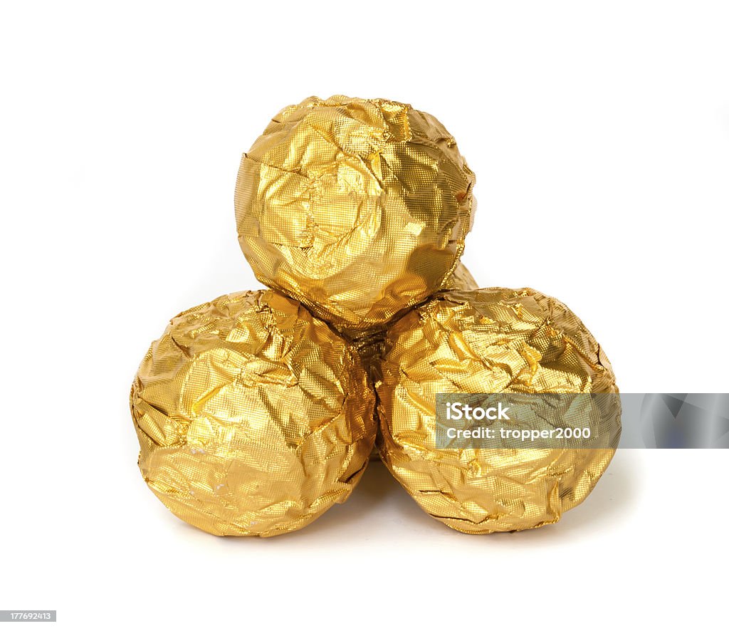 Group of Chocolate balls. Group of Chocolate balls with almond  in a gold foil paper. Candy Stock Photo