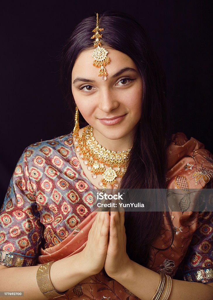 beauty sweet indian girl in sari smiling beauty sweet indian girl in sari smiling, many jewelry Bride Stock Photo