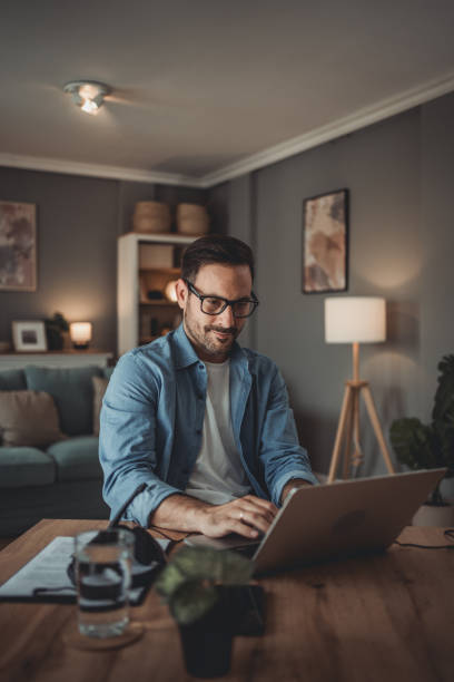 istock Portrait of a handsome Caucasian man using modern devices to work online 1776946637