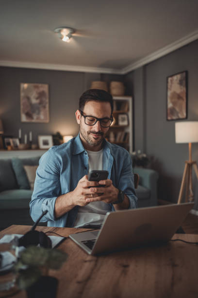 istock Portrait of a handsome Caucasian man using modern devices to work online 1776946644