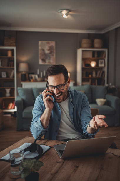 istock Portrait of a handsome Caucasian man using modern devices to work online 1776946648