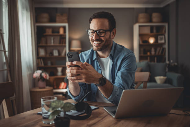 istock Portrait of a handsome Caucasian man using modern devices to work online 1776947164
