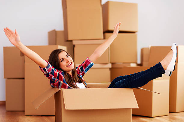 istock Cheerful woman sitting in a cardboard box 177694775