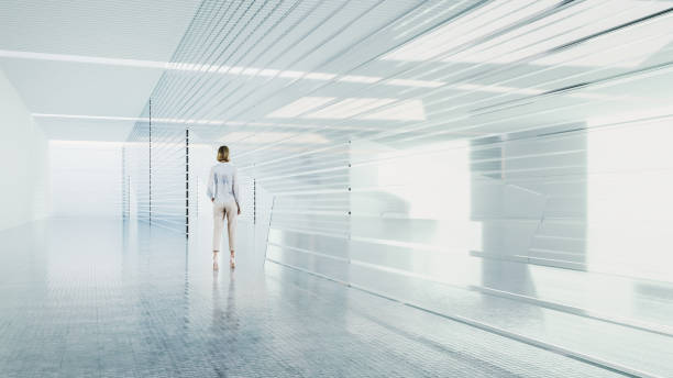 istock Businesswoman standing in empty office corridor 1776964802