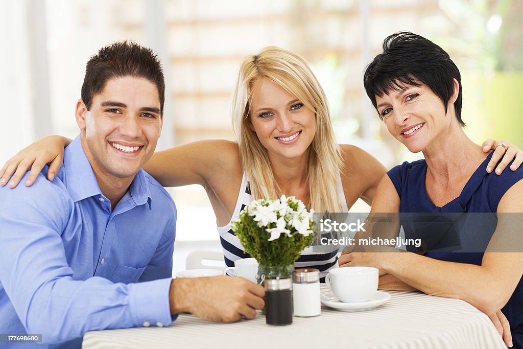 happy young man with wife and mother-in-law happy young man with wife and mother-in-law in cafe Son-In-Law Stock Photo