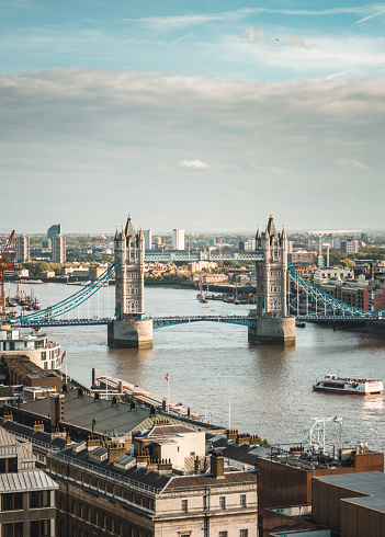 Beautiful sunset view to the skyline of London, United Kingdom, with the famous Tower Bridge and modern skyscrapers along the Thames river