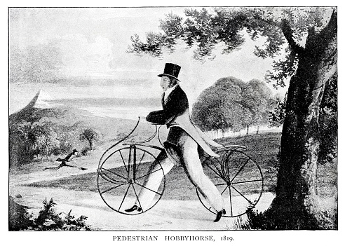 Pedestrian Hobbyhorse 1819
showing Denis Johnson who first imported the hobby horse into Britain in 1818.
The forerunner of the bicycle, the 'hobby' or 'dandy horse' was invented by the German Baron Karl von Drais in France in 1817. It was introduced to England the following year by Denis Johnson, a coachmaker of Long Acre, London, who described it as a 'Pedestrian Curricle'. Hobby horses had no pedals or brakes, but were propelled by the rider pushing on the ground with his feet, and dragging the feet to slow the machine. Johnson started a school where prospective purchasers could learn how to ride the machine and, in 1819, fashionable London society was briefly gripped by a craze for riding a hobby horse.
Man on Draisine bicycle in Jardin de Luxembourg
Original edition from my own archives
Source : Picture Magazine Vol.1 1893