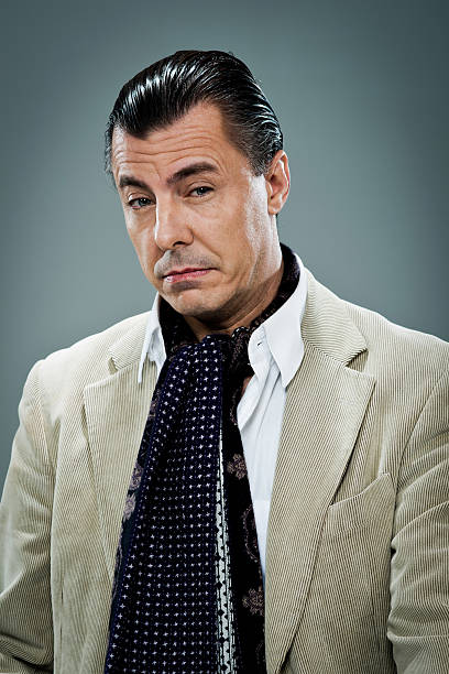 Mature Man with Serious Expression  http://www.tuscanipassion.com/istock/facialexpressions.jpg slicked back hair stock pictures, royalty-free photos & images