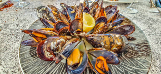 istock Steamed mussels , boiled , with lemon , plated 1777013202