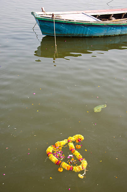 istock ritual flowers and boat in Ganges river, Varanasi,India 177701743
