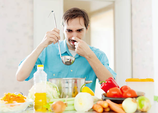istock Man with ladle testing foul food 177702528