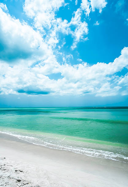 Beach Shoreline and Cloudscape, Relaxation, Naples Florida USA "Beach Shoreline and Cloudscape, Relaxation, Naples Florida USA" naples beach stock pictures, royalty-free photos & images