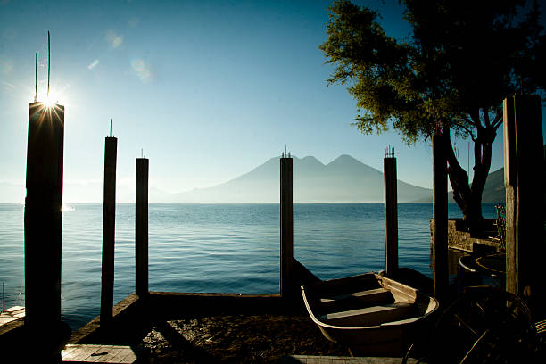 A boat in the lake of Atitlan, Guatemala, in background the vulcan of Atitlan.