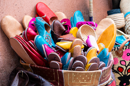 A variety of colorful shoes on display at the market in Marrakesh, Morocco.