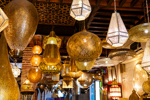 Variety of ornate lamps being sold in the market of Marrakesh, Morocco.