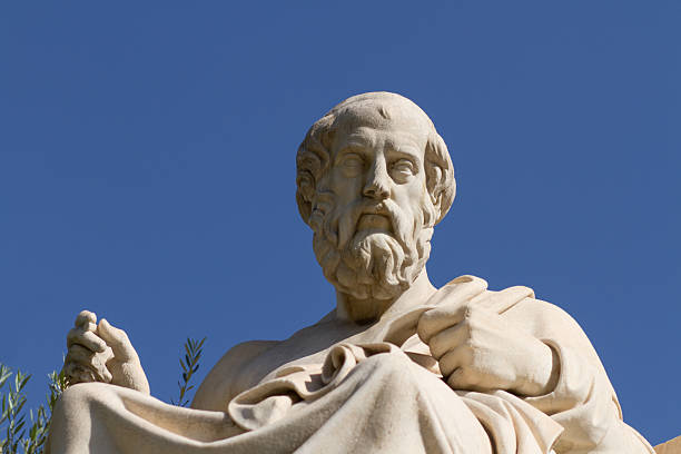 Statue of Plato in Greece Plato, Greek philosopher. A disciple of Socrates and the teacher of Aristotle, he founded the Academy in Athens. This is his statue, located before the Academy of Athens, Greece. aristotle stock pictures, royalty-free photos & images