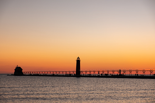 Sunset at the Grand Haven lighthouse and pier on Lake Michigan, Michigan, USA