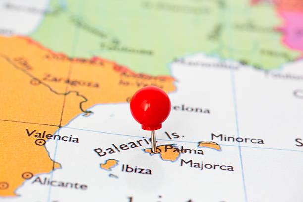 Red Pushpin on Map of Majorca Round red thumb tack pinched through city of Palma, Majorca on Spain map. Part of collection covering many major capitals and cities of Europe. balearic islands stock pictures, royalty-free photos & images