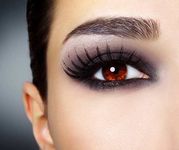 istock Close up of woman's eye with heavy make up and red iris 177708015