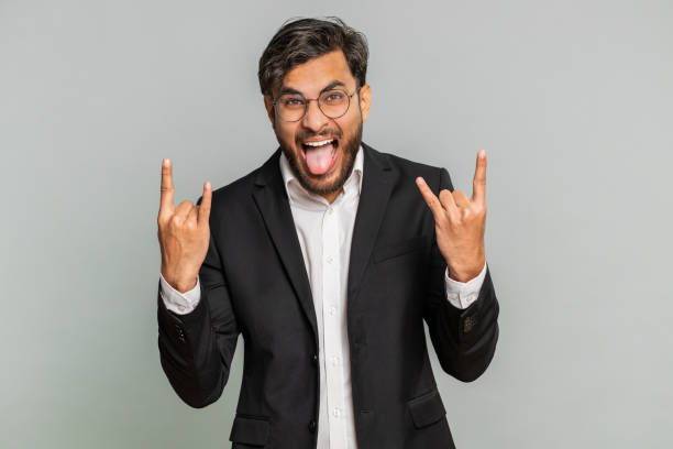 istock Happy businessman showing rock n roll gesture, cool sign, crazy expression dancing, victory, win 1777088806