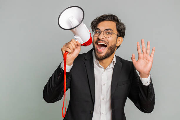 istock Indian man talking with megaphone, proclaiming news, loudly announcing advertisement discounts sale 1777088909