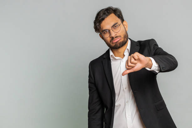istock Upset businessman showing thumbs down gesture disapproval dissatisfied dislike negative feedback 1777089369