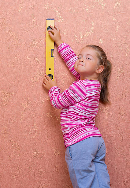 istock Girl with measuring level 177709361