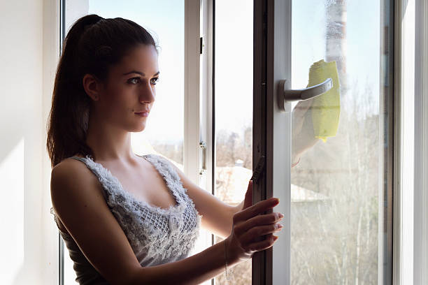 istock Girl washes a window 177709473