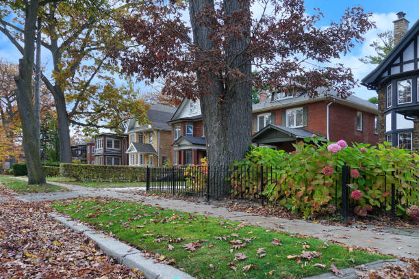istock Tree lined residential street in autumn with leaves falling 1777099975